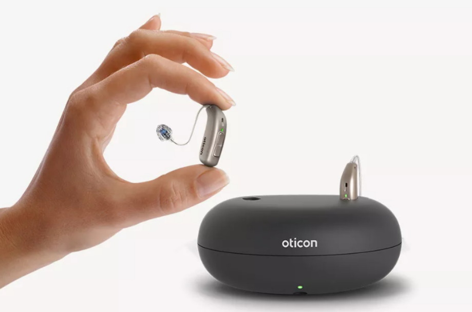 A close-up image of a modern hearing aid device with advanced features.